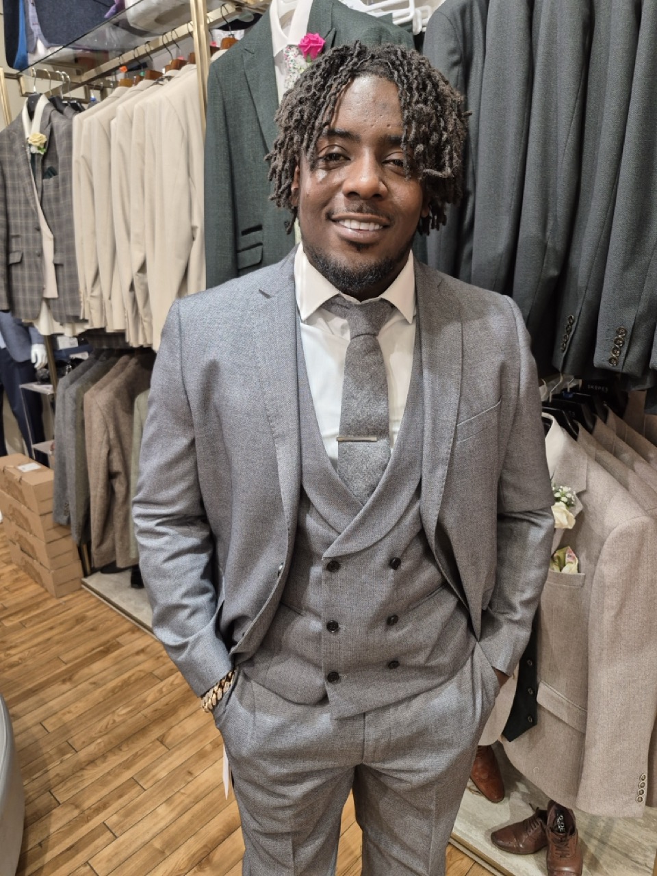 A customer being fitted for a three-piece suit at Scotney's of London Road