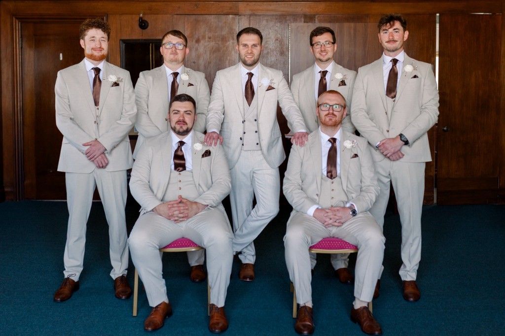 Wedding party in cream three-piece suits with brown ties, hired from Scotney’s of London Road