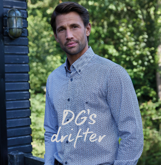 Man in a blue and white printed button-down DG's Drifter shirt